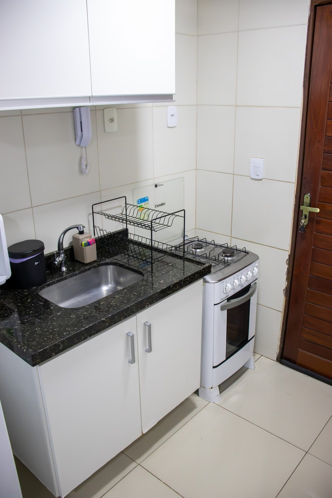 Apartamento 104 · Cozinha completa — Aruanda