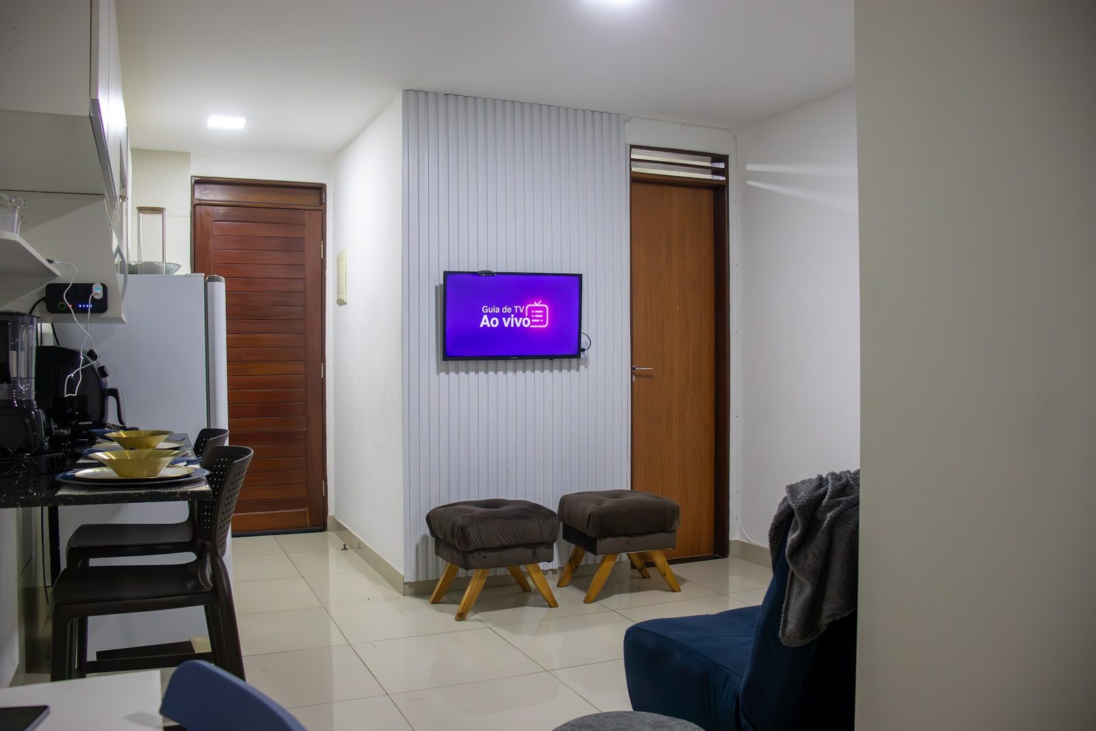 Apartamento 104 · Sala com TV — Aruanda
