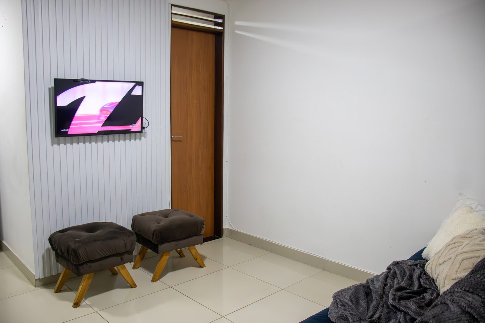Apartamento 104 · TV e área de estar — Aruanda