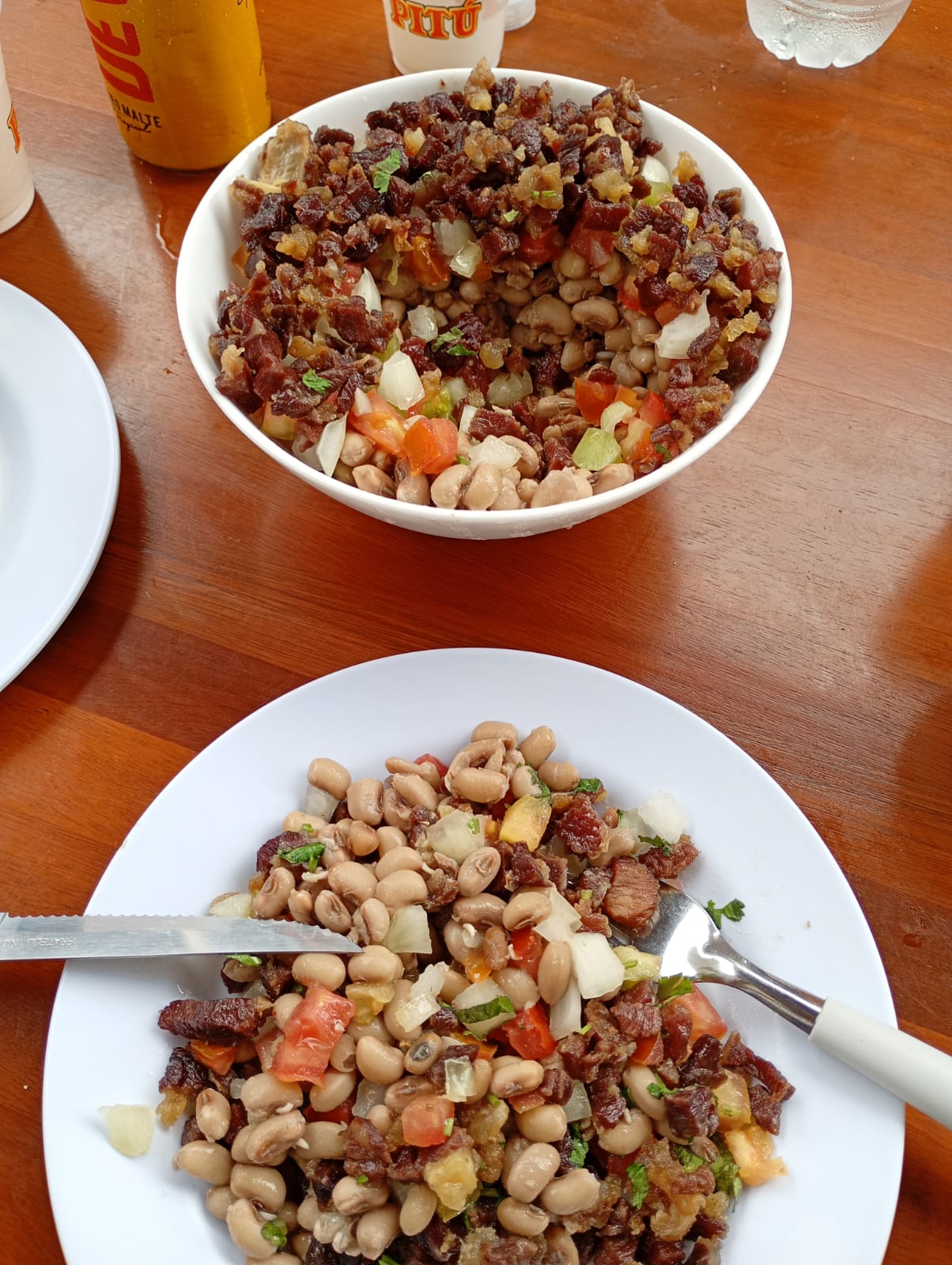Arrumadinho on a platter, with black-eyed peas, beef, cheese and vinaigrette