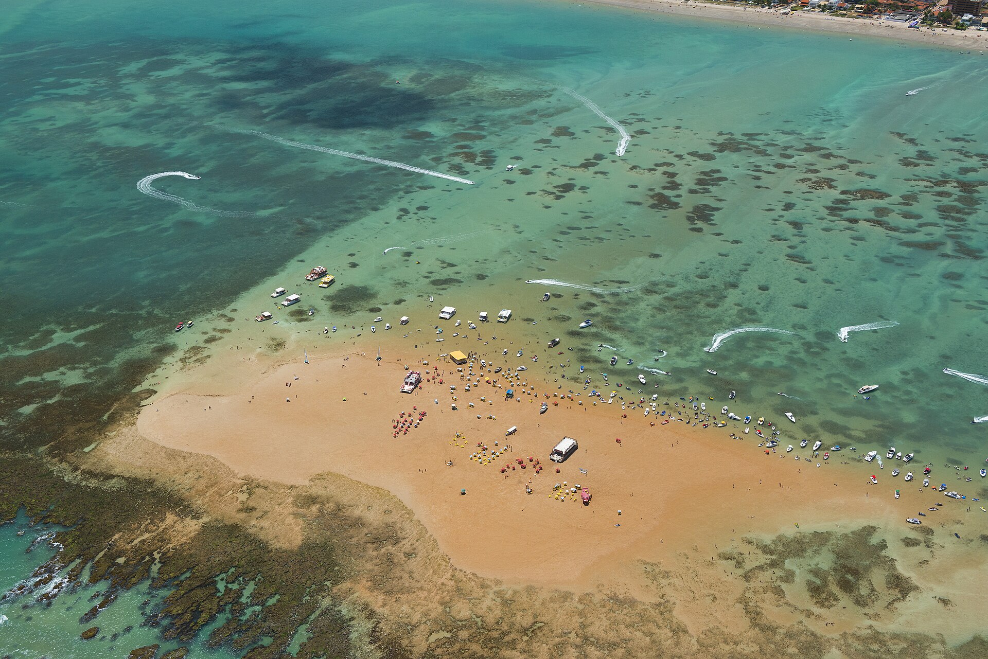 The Areia Vermelha sandbank and green sea from above