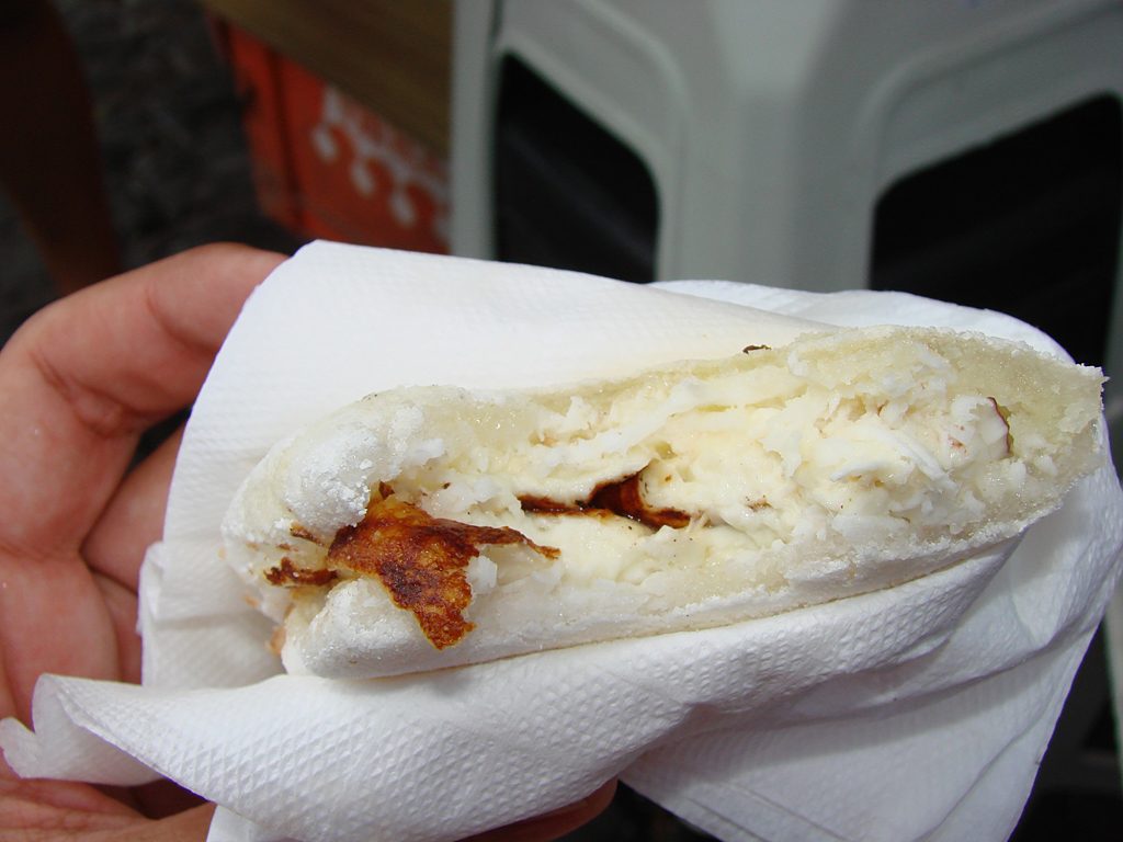 A filled tapioca served in a napkin, made to order